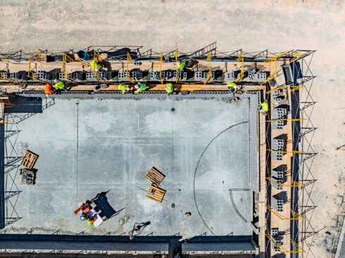 Overhead drone view of masons on scaffolding at Skye Canyon Elementary