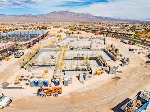 Aerial view of masonry work at Skye Canyon Elementary with mountains behind